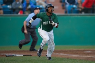 Center fielder B.J. Boyd watches his first inning triple hit off the right field wall as he runs down the first base line in Paly's CCS semifinal loss against Valley Christian High School. &nbsp;Boyd scored the Vikings' only two runs in the game.